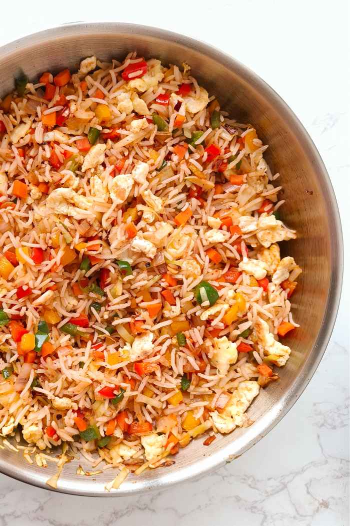 vegetable fried rice in a stainless steel pan