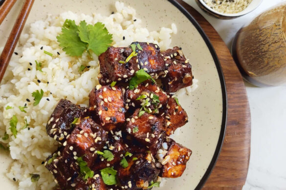 Instant-Pot-General-Tsos-Tofu-in-a-plate-with-sticky-sauce-and-sesame-seeds-rotated