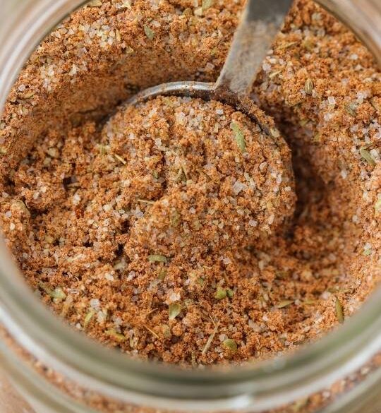 homemade fajita mix in a mason jar with a spoon