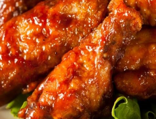 a pile of baked buffalo chicken wings
