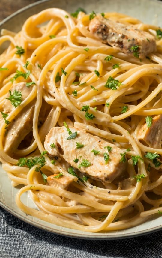 close up to creamy Chicken Alfredo dish