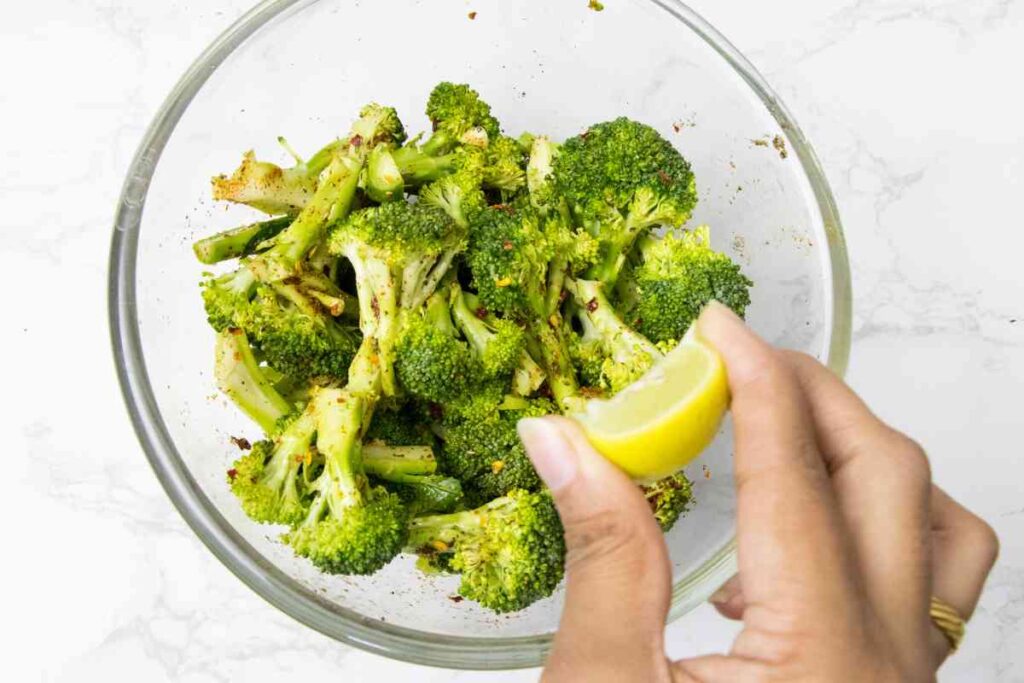 seasoned broccoli in a glass bowl