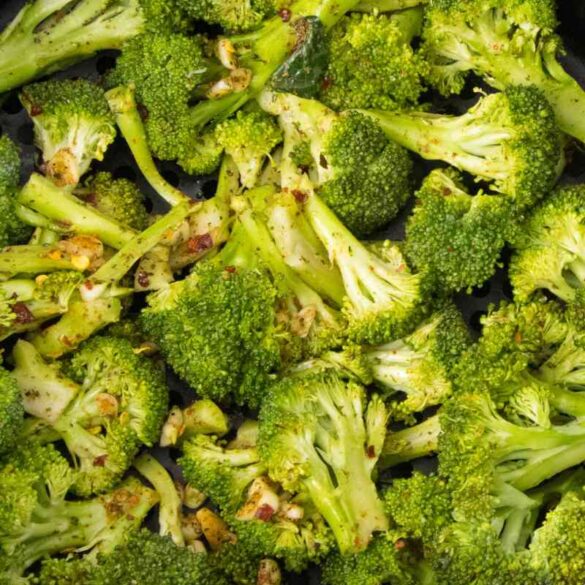 seasoned broccoli in air fryer basket