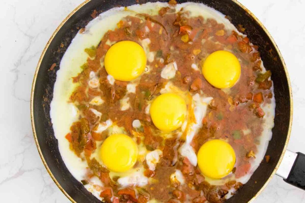 Close up shot of cooked shakshuka in a pan