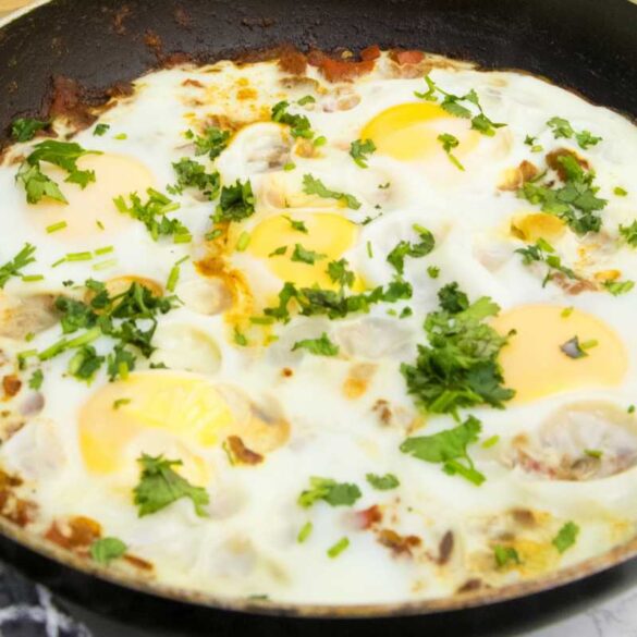 Shakshuka consists of a tomato sauce seasoned with various spices, and eggs that are poached directly in the sauce