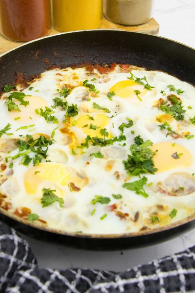 Shakshuka consists of a tomato sauce seasoned with various spices, and eggs that are poached directly in the sauce