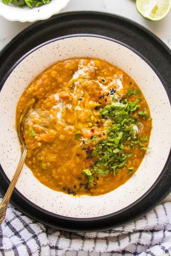 red lentil soup recipe served on a white bowl