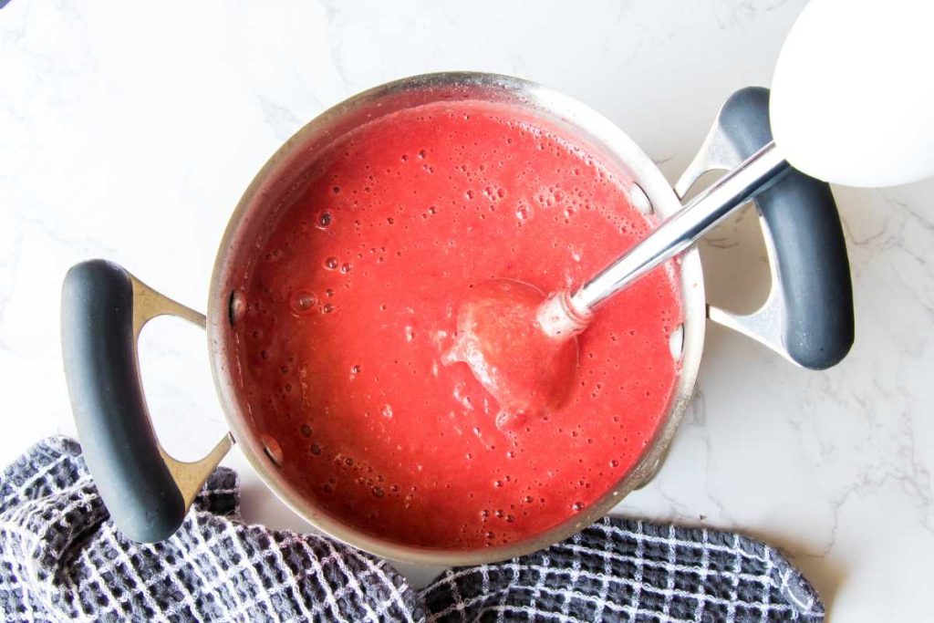 using immersion blender to blend the beet soup