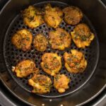 air fryer smashed potatoes in black air fryer basket