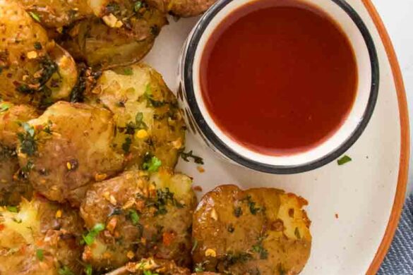 crispy air fried smashed potatoes served with tomato sauce